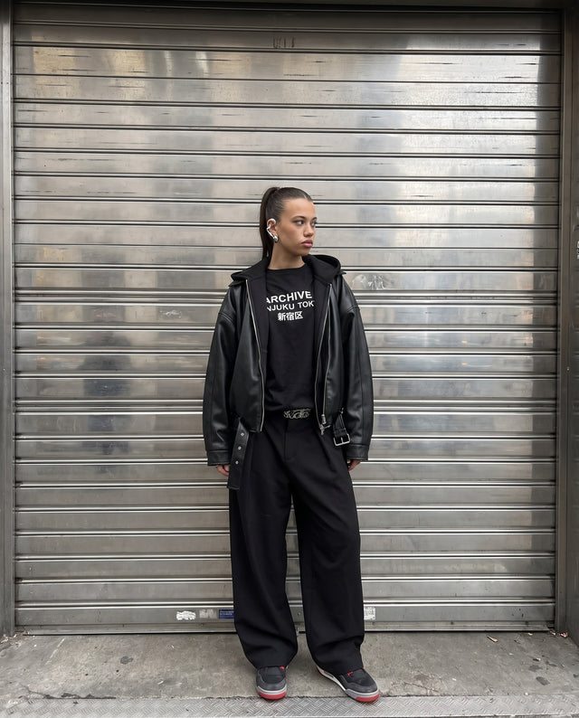 Against a steel roller shutter, wearing the Morph Ear Cuff