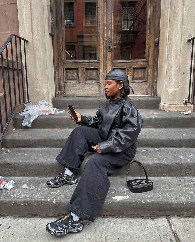 On a brownstone stoop, wearing the Morph Ear Cuff