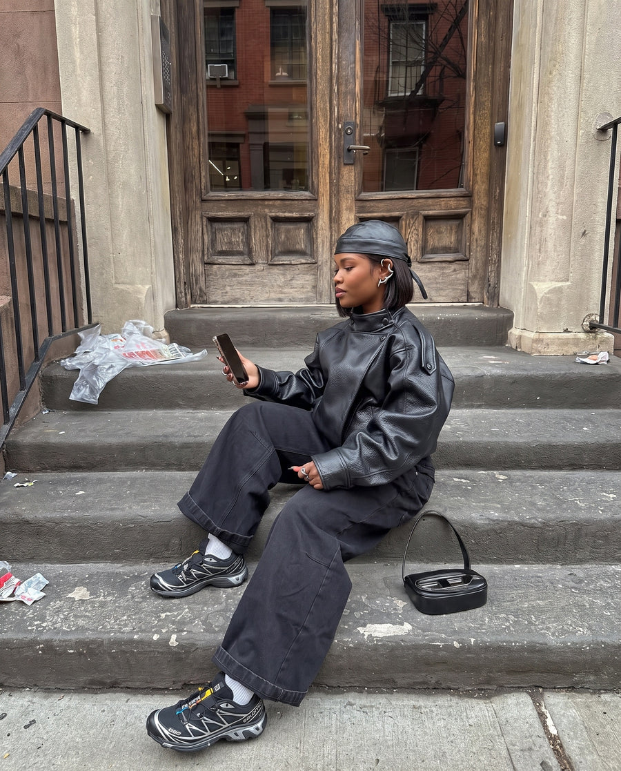 On a brownstone stoop, wearing the Morph Ear Cuff