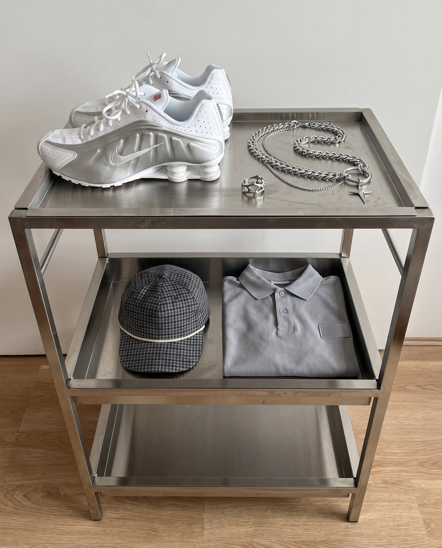 Steel trolley flat-lay with the Hack Necklace and Wraith Ring